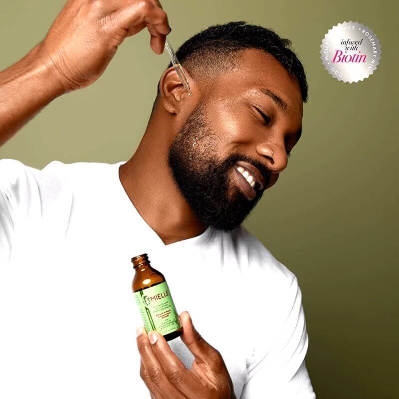 rosemary hair oil - male customer applying it on his beard